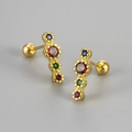 Macro view of S925 silver gold-plated stud earrings with four colorful gradient crystals - Gold Rainbow Zirconia