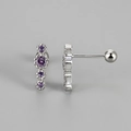 Detailed macro view of S925 silver stud earrings with four purple zircon stones - White Gold Purple Zirconia