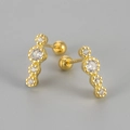 Macro shot of gold-plated screw back studs featuring four vertically aligned sparkling crystals - Gold White Zirconia