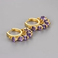 Gold hoop earrings with dangling purple zircon stones in a classic claw setting - Purple Zirconia Tassel Huggie