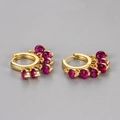Polished gold hoop earrings featuring five vibrant magenta zircon tassel charms - Red Zirconia Tassel Huggie