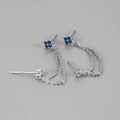 Macro shot of S925 sterling silver chain earrings with blue clover zircon for double piercing - Platinum-Dark Blue