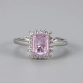 Detail of a rectangular pink gemstone ring with white zircon halo on a silver band - Silver/Pink