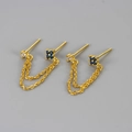 Detail of gold double piercing chain earring with white zircon and navy blue gemstones - Gold-Dark Blue