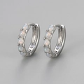 Elegant silver opal hoop earrings featuring five round iridescent stones on gray background - Large / Silver - White