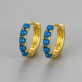 Detailed macro of gold plated hoop earrings featuring five blue round opal gemstones - Large / Gold-Blue