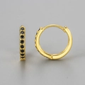 Detailed view of gold huggie earrings featuring a row of pave black cubic zirconia stones - Single Row Zirconia Earrings / Gold-Small-Black Rhinestone