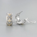 Orecchini a quadrifoglio in argento spazzolato con accenti dorati e zirconi cubici - Oro bianco