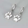 Polished silver cat paw hoop earrings with cute dangling animal footprint charms - White Gold