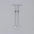 Detailed macro view of minimalist silver chain tassel earrings with black cubic zirconia - Copper / Platinum Black Zirconia