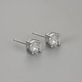 Minimalist four-prong round zircon stud earrings with polished silver metal finish - White Gold / 6mm