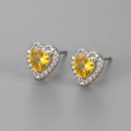 Detail of heart-shaped yellow zircon stud earrings with silver halo setting - Yellow Zircon