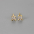 Macro shot of 4-prong round zircon stud earrings with classic gold plating finish - Gold / 4mm