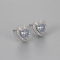 Macro view of heart-shaped earrings with purple zircon and silver-toned halo settings - White Zircon