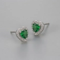 Detailed close-up of heart-shaped green zircon studs with silver halo and pavé crystals - Green Zircon