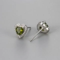 Macro detail of silver heart studs with green zircon stone and pavé crystal border - Olive Green