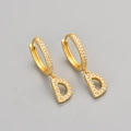Golden letter D hoop earrings with sparkling pave-set zircons in a minimalist style - Gold / D