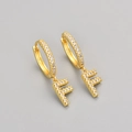Gold plated huggie earrings with letter F pendant and micro-pave cubic zirconia stones - Gold / F