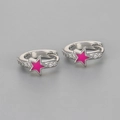 Macro detail of silver-tone hoop earring featuring a vibrant pink enamel star and sparkling zircons - Copper / Silver Fuchsia