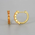 Detail of gold huggie earrings featuring emerald-cut orange cubic zirconia settings - Gold / Orange