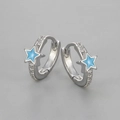 Macro detail of silver star hoop earrings featuring blue enamel and white zircon stones - Copper / Platinum Blue