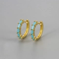 Macro shot of gold hoop earrings featuring rectangular light blue zircon gemstones in a pave setting - Gold/Blue Turquoise