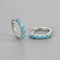 Detailed view of silver hoop earrings with five rectangular light blue zircon stones - Silver/Turquoise