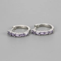 Detailed view of silver hoop earrings with five rectangular lavender zircon stones - Silver / Purple