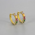 Close-up of golden huggie earrings with five colorful rectangular zircon rainbow stones - Gold/Multi-color Rhinestone