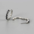 Detail of silver hoop earrings with rectangular black cubic zirconia in open and closed views - Silver/Black Zirconia