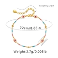 Détail de la cheville en perles colorées avec breloques œil rose et mesures précises - Or 18 carats / Style Mauvais Œil et Perle Colorée (KA0232-1)