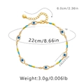 Détails d'une chevillère bohème faite main avec perles Mauvais Œil et fermoir mousqueton - Or 18 carats / Style Mauvais Œil Bleu et Perle de Couleur Mixte (KA0232-2)