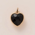 Detail of heart-shaped black faceted gemstone pendant with gold frame and crystal bail - Classic Black Heart Style