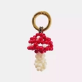 Handmade beaded mushroom pendant with red and white beads and golden ring spring clasp - Mushroom