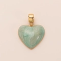 Close-up of a heart-shaped light green pendant with polished 14K gold-plated clasp - Green Heart