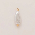 Detailed view of teardrop pearl pendant with 18K gold plated loop on beige texture - Teardrop Pendant