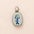 Detail of silver oval pendant with green enamel and blue fishbone motif on beige background - Fishbone Pendant