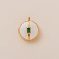 Detailed view of an 18K gold-plated locket with white enamel and green gemstone inlay - Round White Locket Pendant