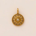 Macro detail of sunburst pendant with center crystal and vintage gold plating texture - Sun Chakra Pendant