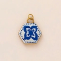 Macro detail of hexagonal ceramic pendant featuring vintage blue floral patterns and gold loop - Hexagon Floral Prosperity Pendant