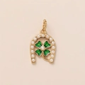Detailed macro view of gold horseshoe pendant with green clover and small white pearls - U-shaped Clover