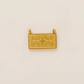 Macro detail of a 18K gold plated rectangular charm with a compass star engraving - Sparkling Star Pendant