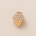 Macro view of a gold acorn pendant featuring micro-set white pearls and a top metal ring - Acorn Pendant
