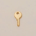 Elegant 18K gold-plated brass key pendant featuring cross-hatch texture on a cream background - Gold Key Pendant