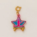 Macro detail of star shaped gold pendant with pink and blue enamel and spring clasp - Ballerina Star / Pale Blue
