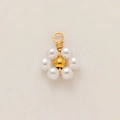 Detailed close-up of 18K gold-plated stainless steel flower pendant with white pearls - Pearl Flower