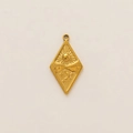 Detailed macro view of 18K gold plated rhombic pendant with sun and moon relief - Rhombus Celestial