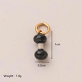 Ciondolo a cuore in acciaio al titanio grigio scuro con anello dorato da 1 cm - Ciondolo Manubrio