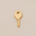 Polished 18K gold-plated copper key charm with textured head and smooth metallic finish - Key Fob