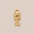 Gold-plated lock pendant featuring pavé-set zircons and a hollow clover motif charm - Hollow Rhinestone Heart Lock Pendant